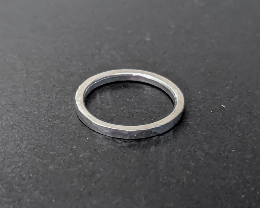 Thick sterling silver stacking ring with a with a hammered texture