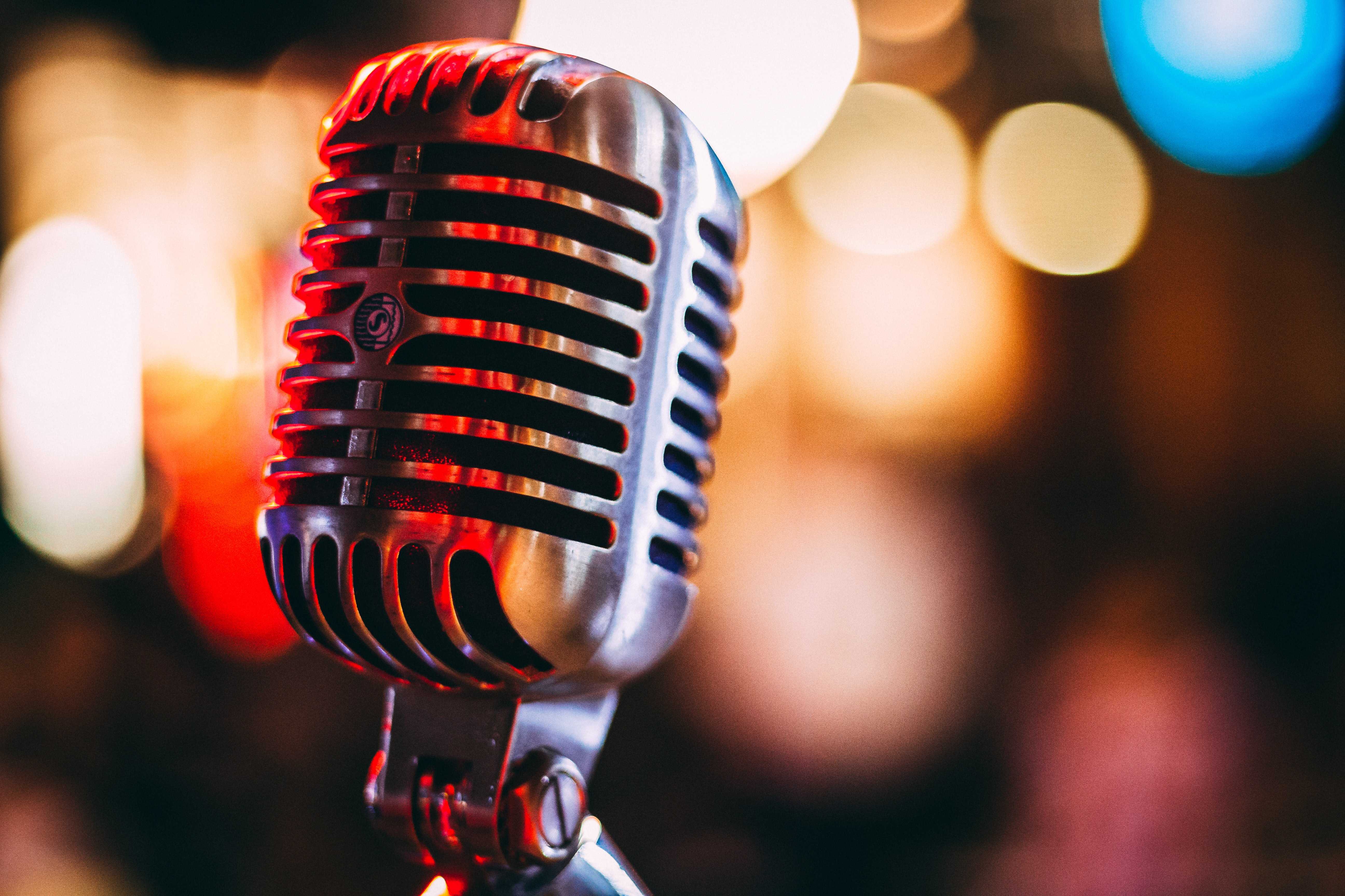 A condenser microphone with a bokeh background