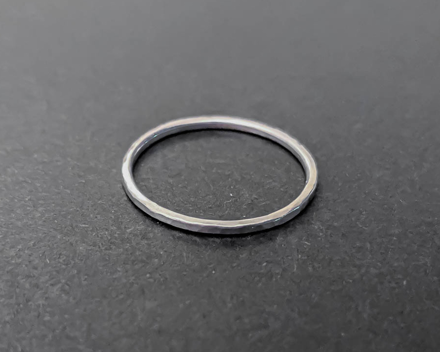 Very thin sterling silver stacking ring with a hammered texture