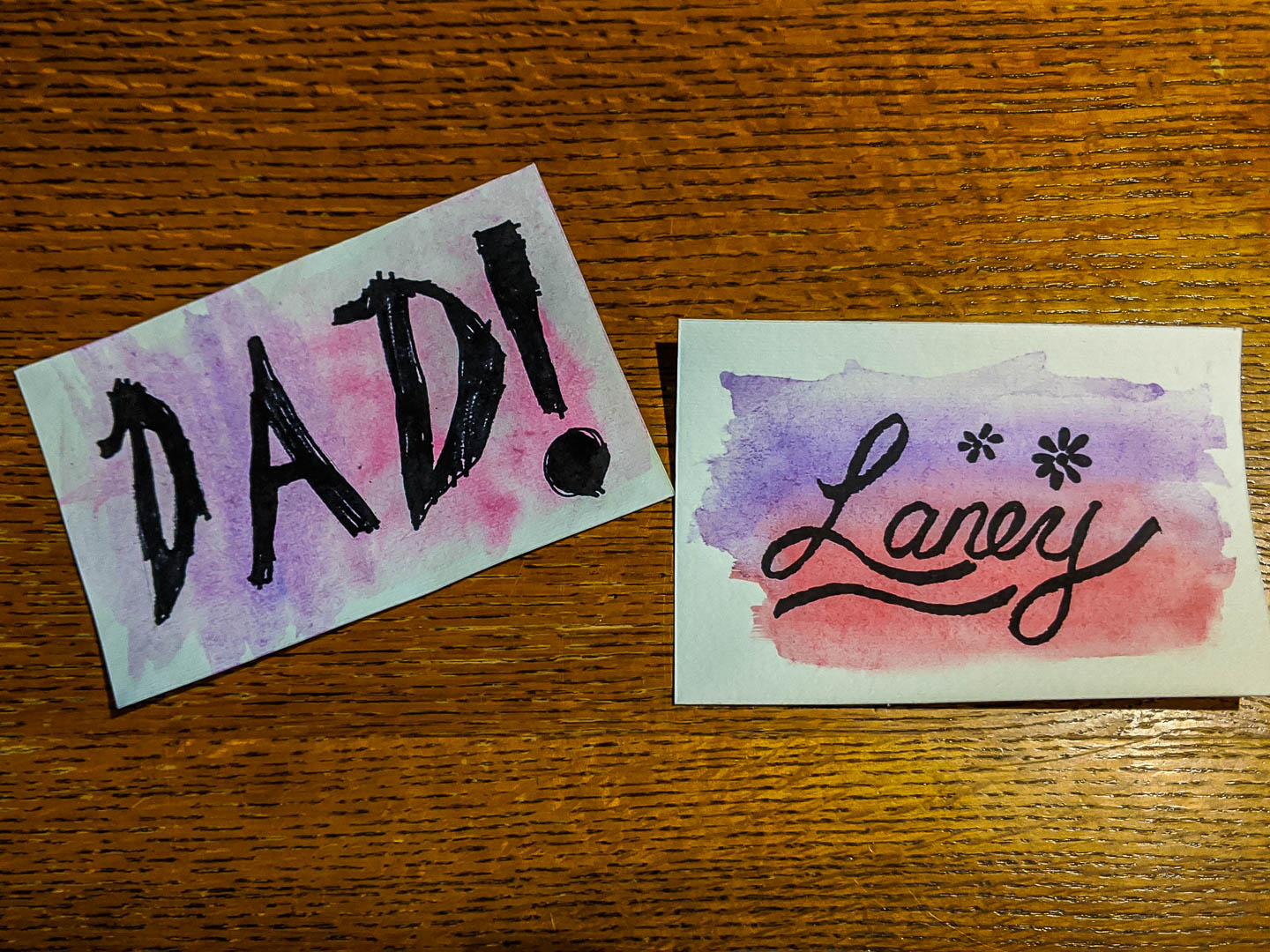 Name cards made with watercolor paint and permanent marker