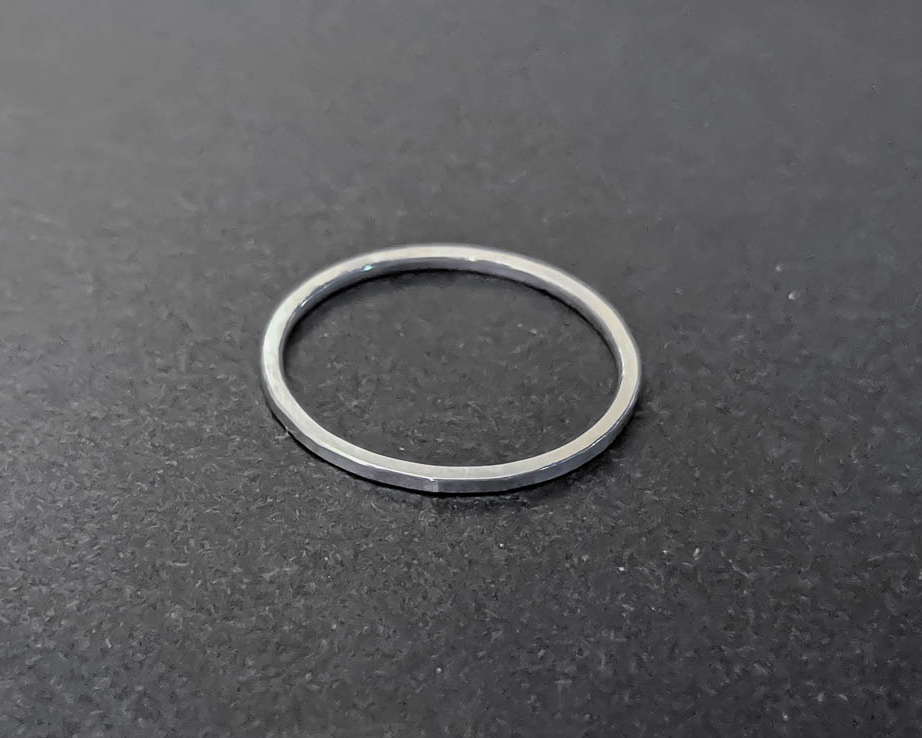 Very thin sterline silver stacking ring with a subtle hammered texture