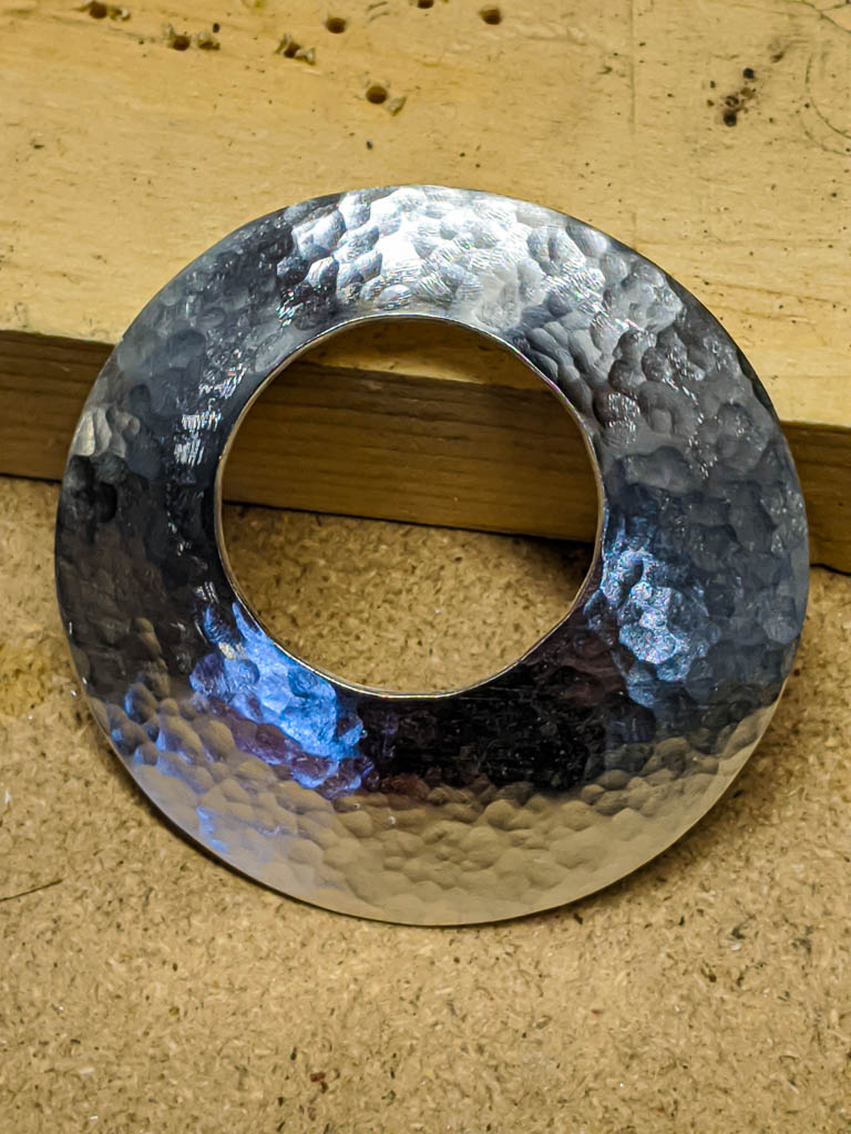 Photo of the pendant after cutting and hammering, before polishing